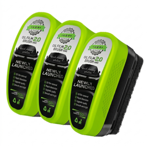 Three oil film brush packages with green handles on a white background