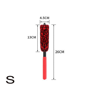 Red and black brush with measurements on a white background