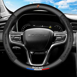 Steering wheel with ROewe logo on a car dashboard