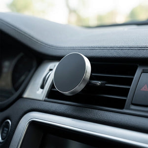 Car air vent with a magnetic phone holder attached