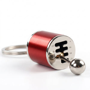 Red and silver keychain lock with key on a white background