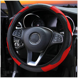 Steering wheel cover with red and black design on a car steering wheel
