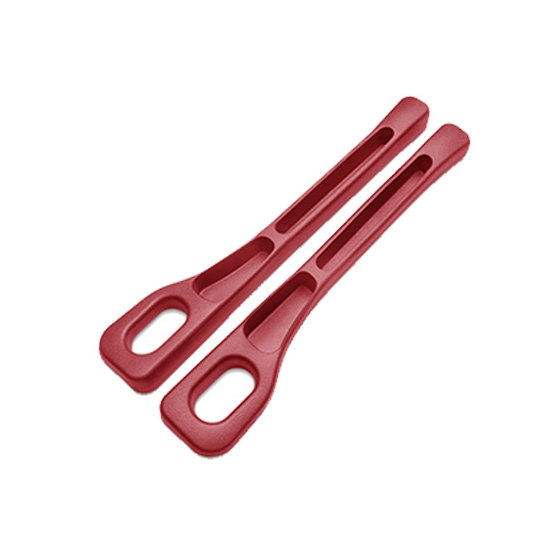 Two beige kitchen tongs on a white background