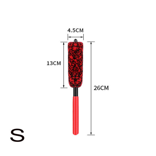 Red and black brush with measurements on a white background