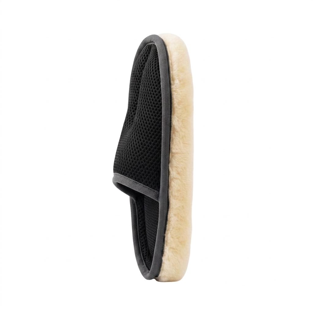 Black and beige grooming brush on a white background