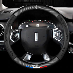 Steering wheel with 'WEY' branding in a car interior