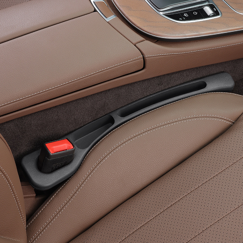 Close-up of a car's brown interior with a seat and door handle.
