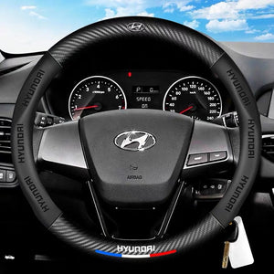 Hyundai steering wheel and dashboard with clear sky background