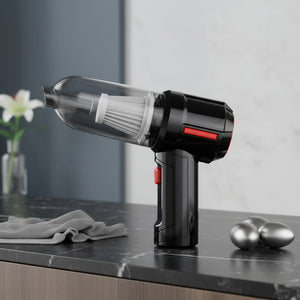 Handheld vacuum cleaner on a kitchen counter with a neutral background