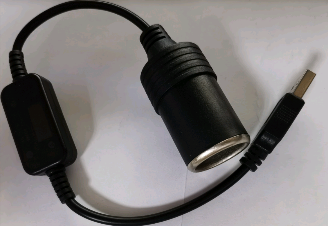 Black car charger adapter on a white background