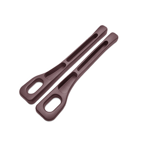 Two brown plastic tools on a white background