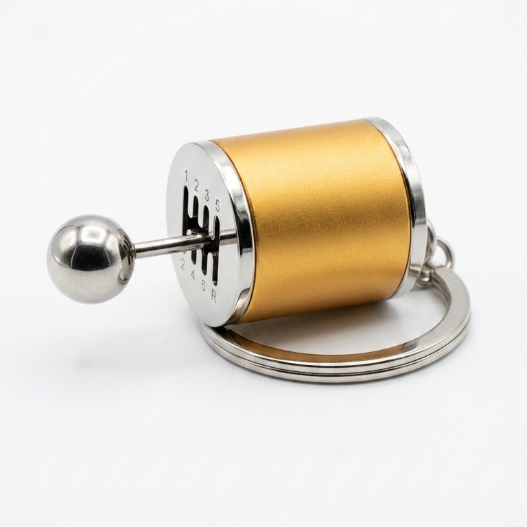 Gold and silver cylindrical keychain on a white background