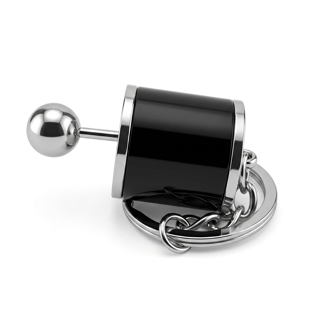 Metallic door handle with black cylindrical component on a white background