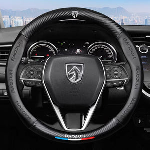 Steering wheel with a brand logo on a car dashboard