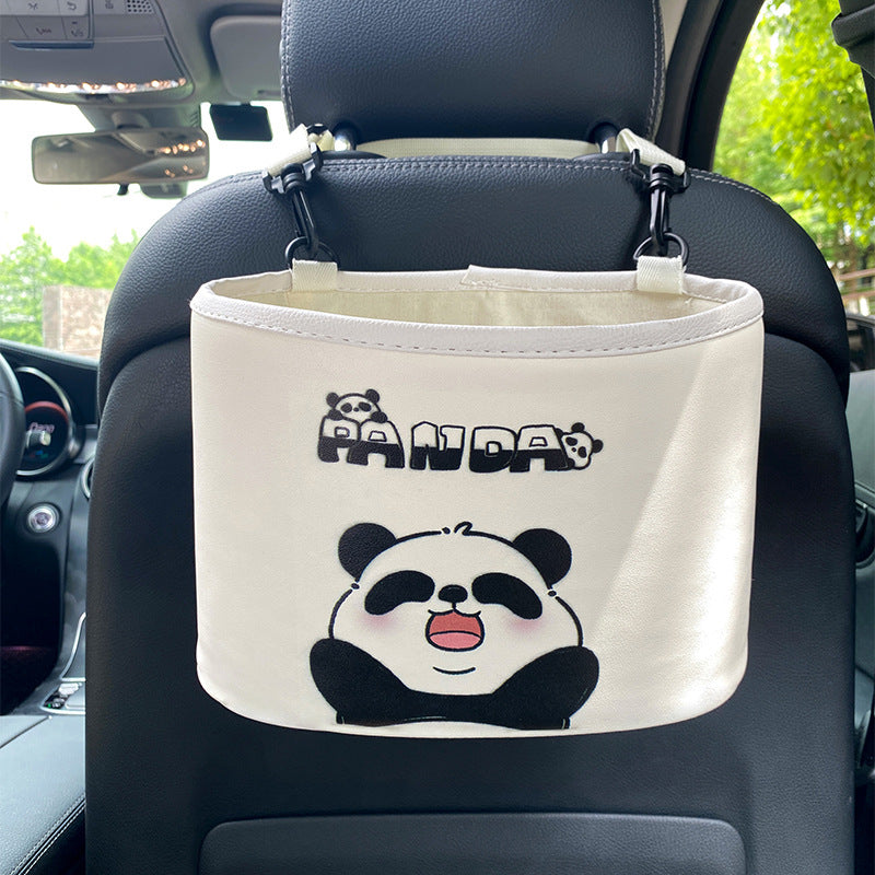 Car organizer with panda design hanging from a car's headrest.
