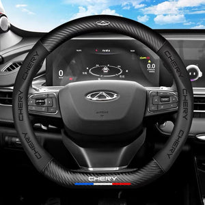 Steering wheel and dashboard of a Chery vehicle with a clear sky background