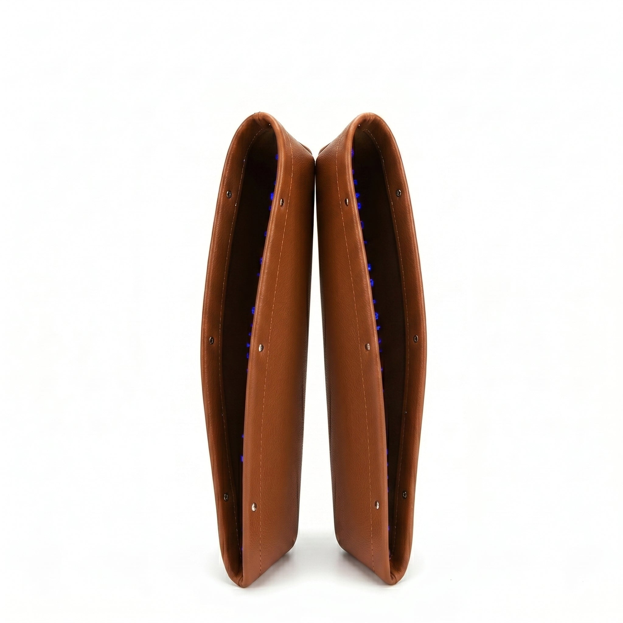 Pair of brown leather boot covers on a white background